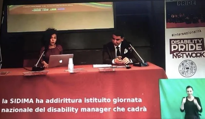 Palma Marino Aimone al tavolo dei relatori del Disability Pride; nel riquadro, l’interprete della lingua dei segni (LIS).